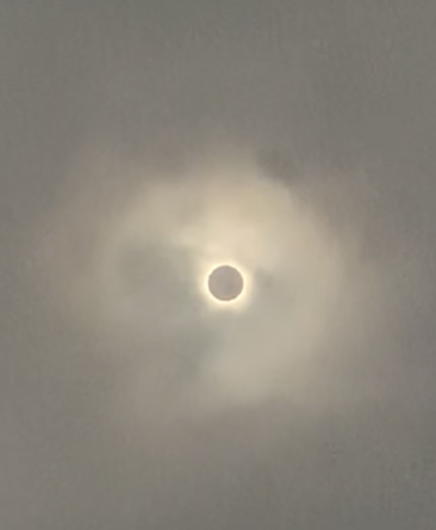 A sun eclipse in the clouds

Description automatically generated