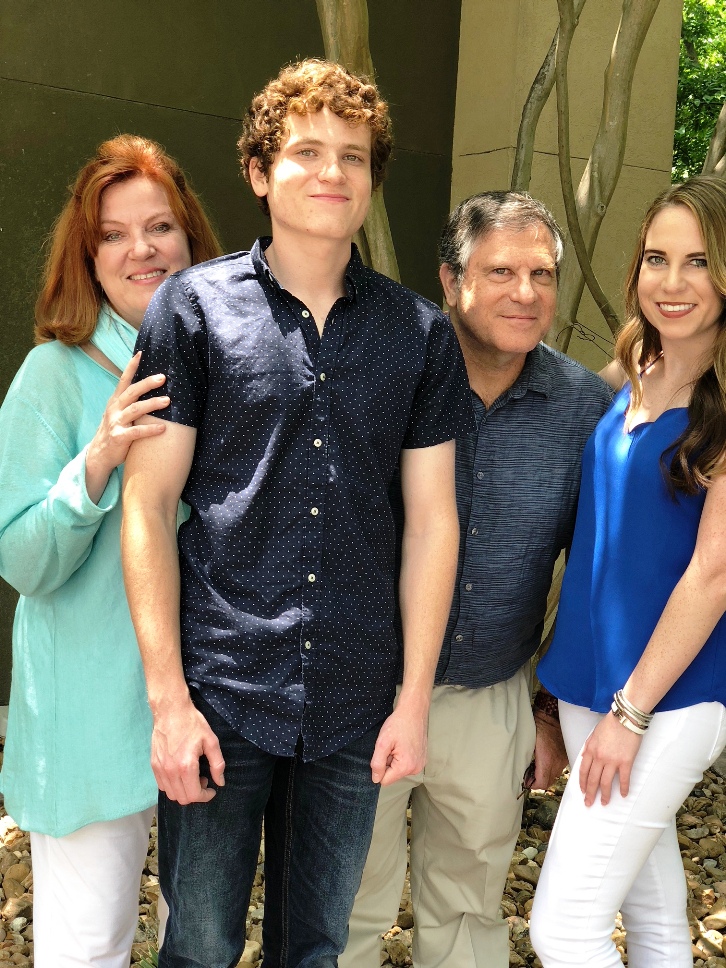 A group of people posing for a photo

Description automatically generated
