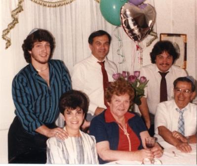 A group of people posing for a photo

Description automatically generated