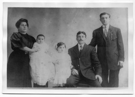 A family posing for a photo

Description automatically generated