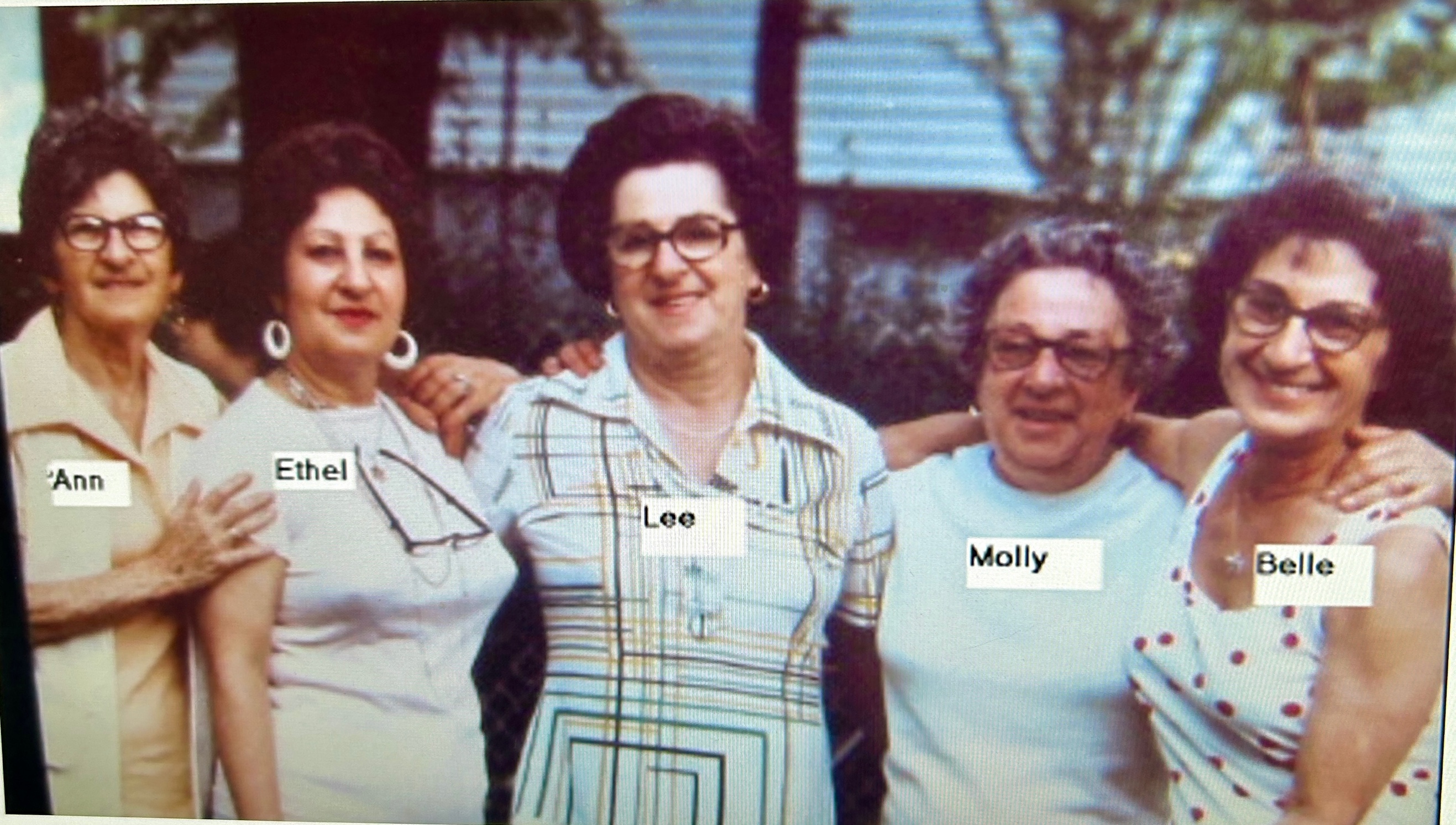 A group of people posing for a photo

Description automatically generated