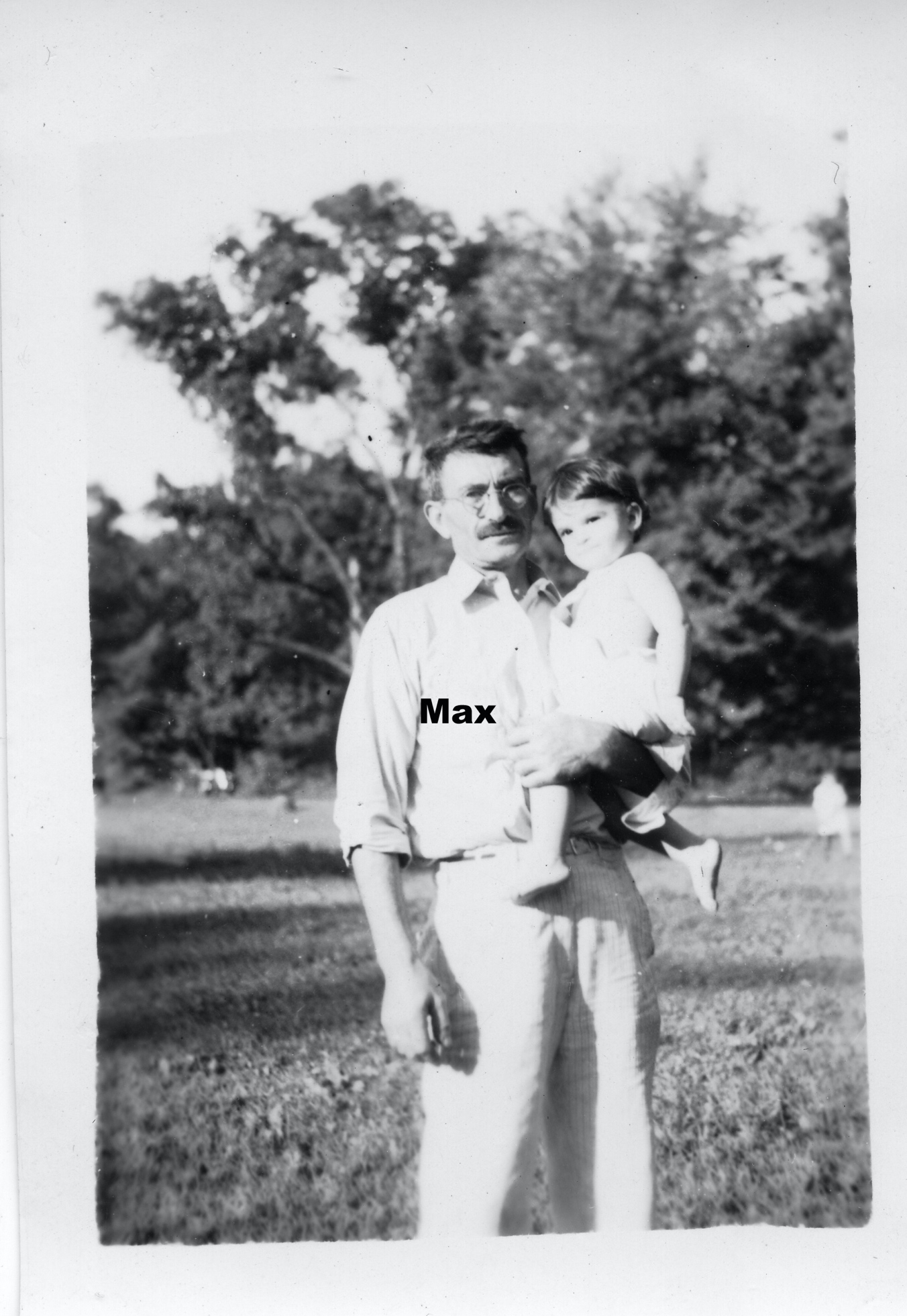 A person holding a child

Description automatically generated