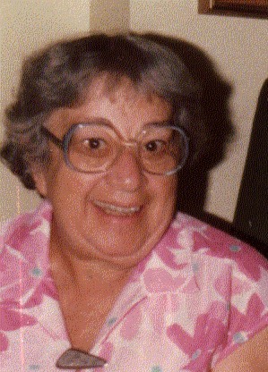 A person wearing glasses smiling

Description automatically generated