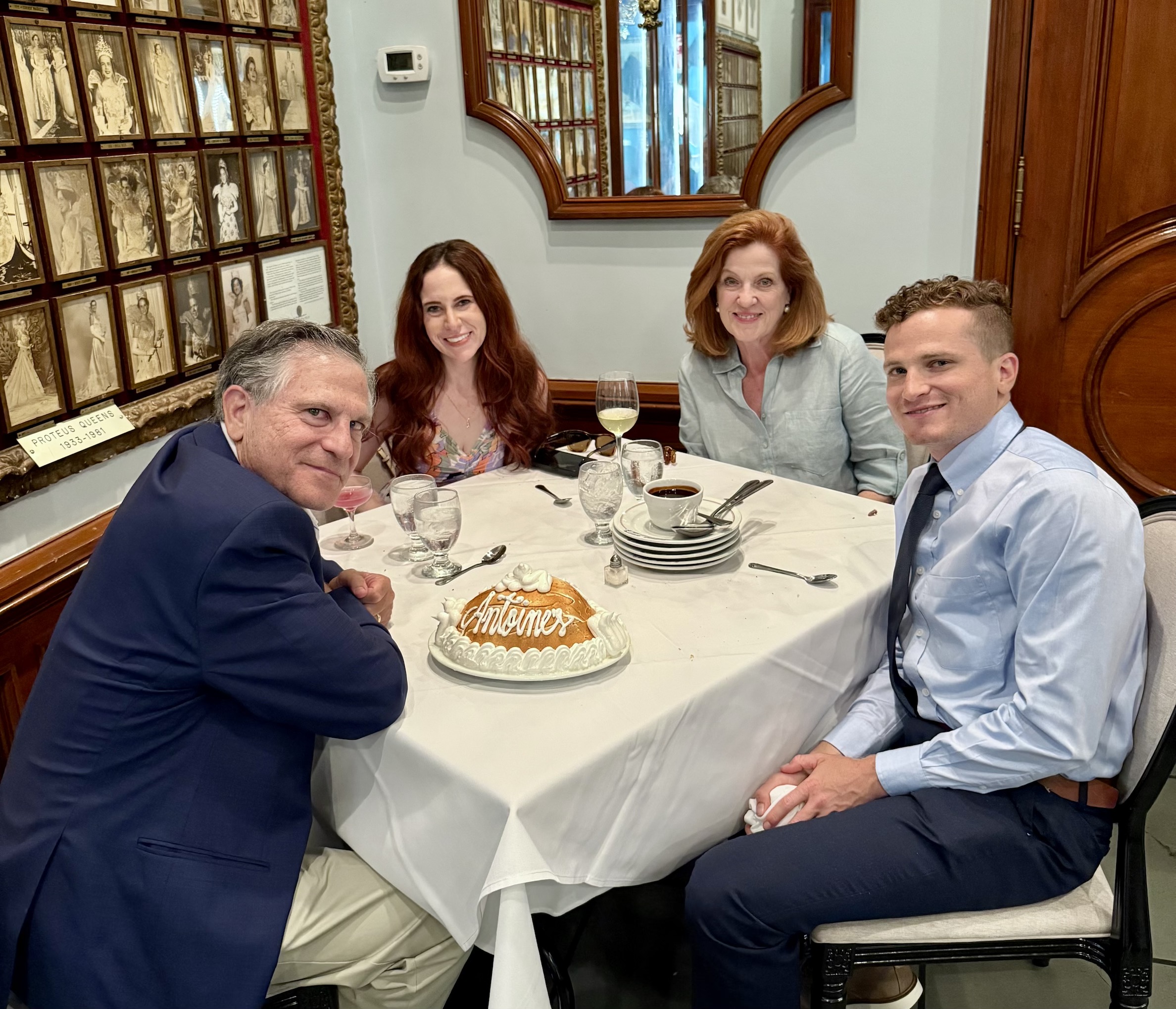 A group of people sitting at a table
Description automatically generated