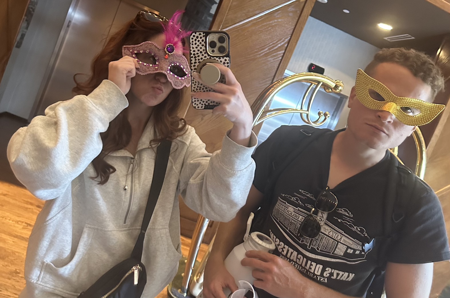 A person and person taking a selfie
Description automatically generated