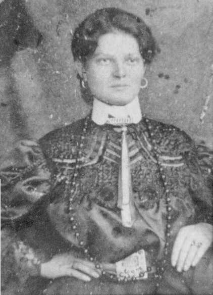 A person in a black and white photo

Description automatically generated