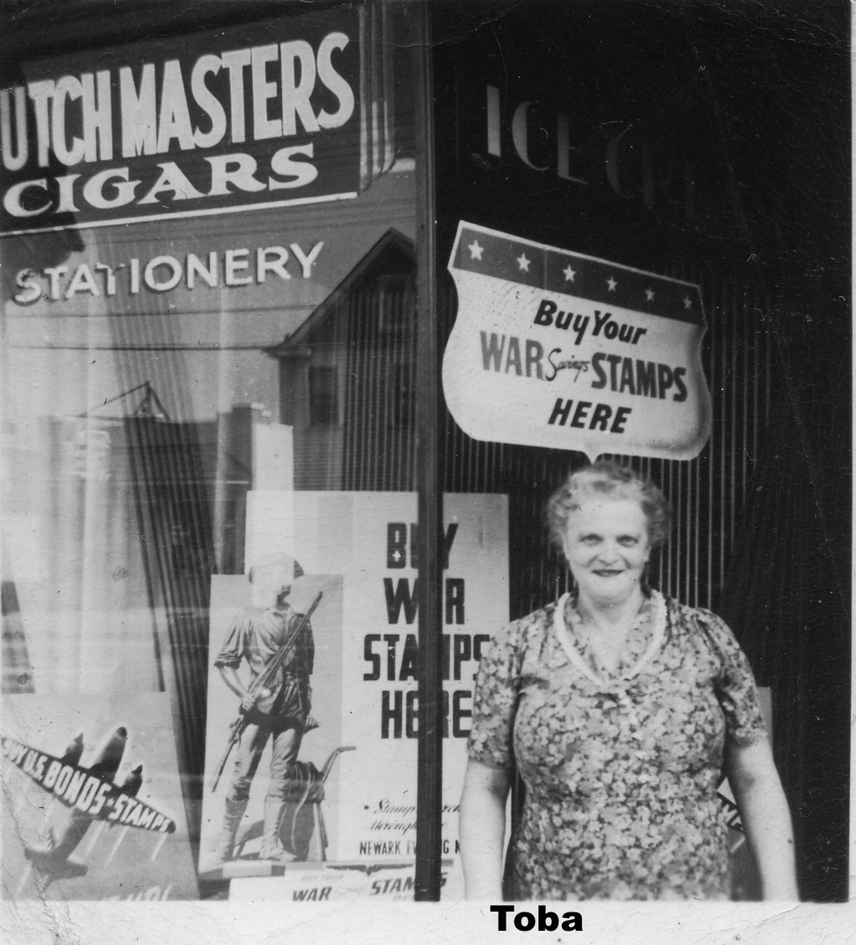 A person standing in front of a store

Description automatically generated