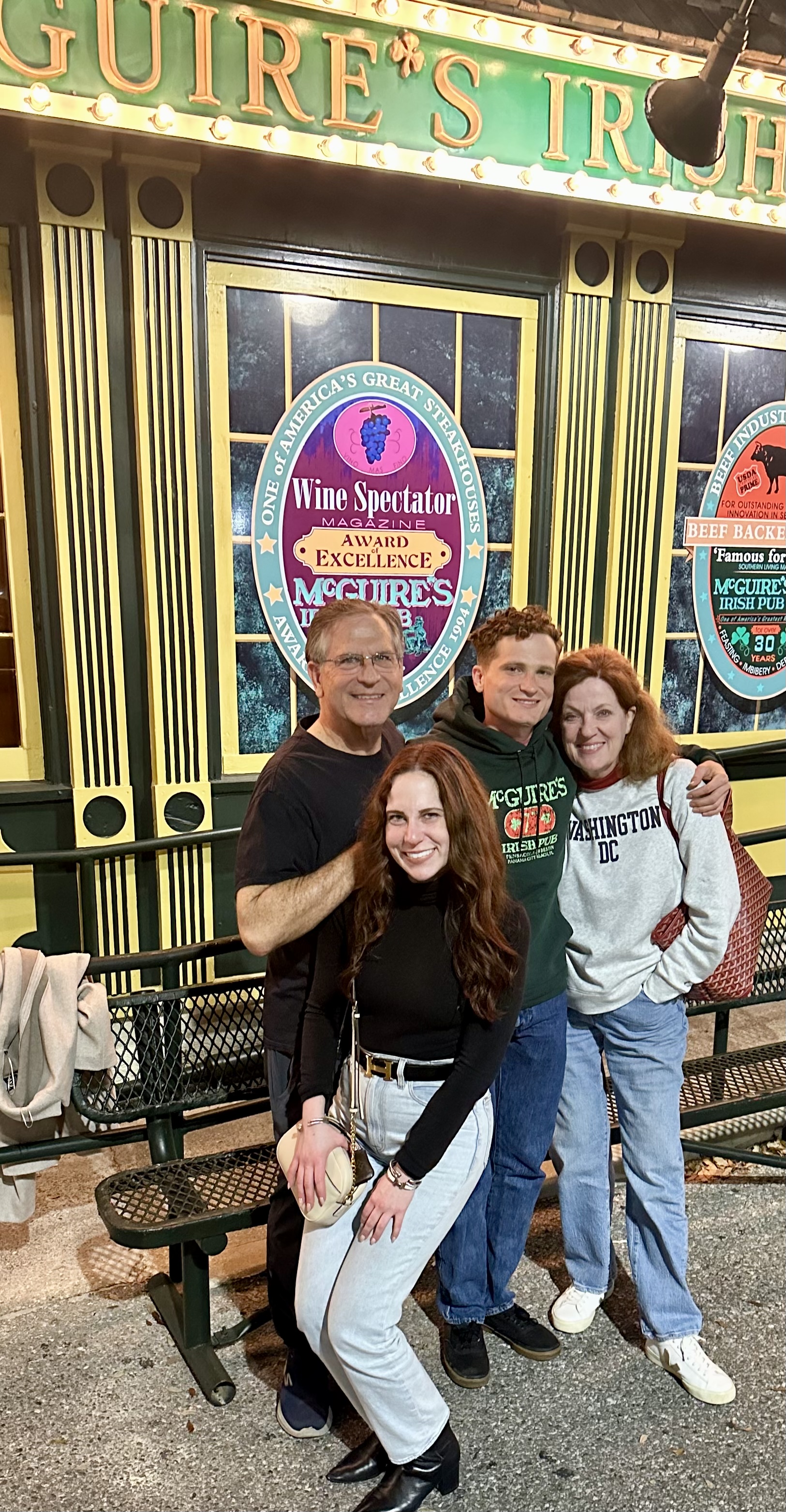 A group of people posing for a photo

Description automatically generated