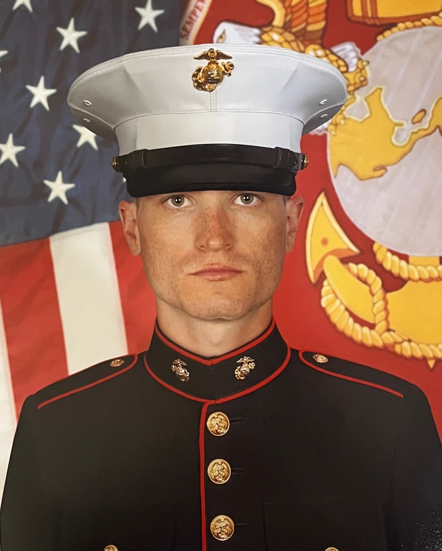 A person in a uniform
Description automatically generated