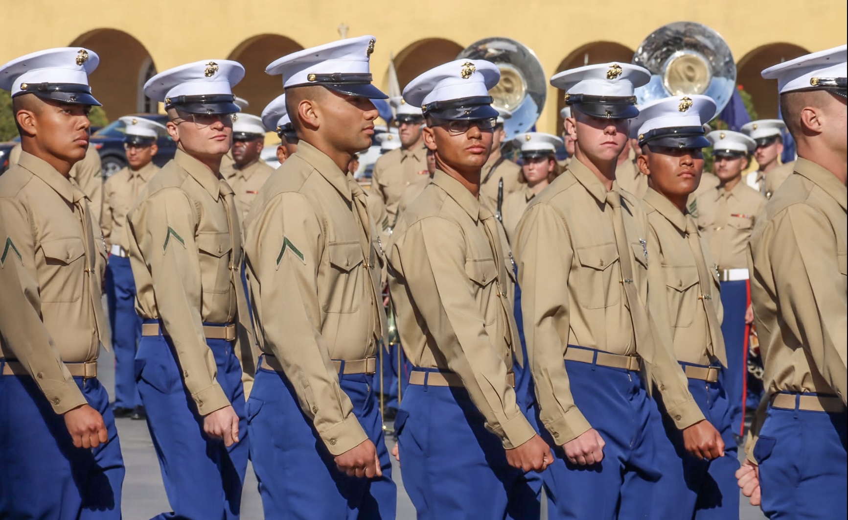 A group of soldiers marching
Description automatically generated