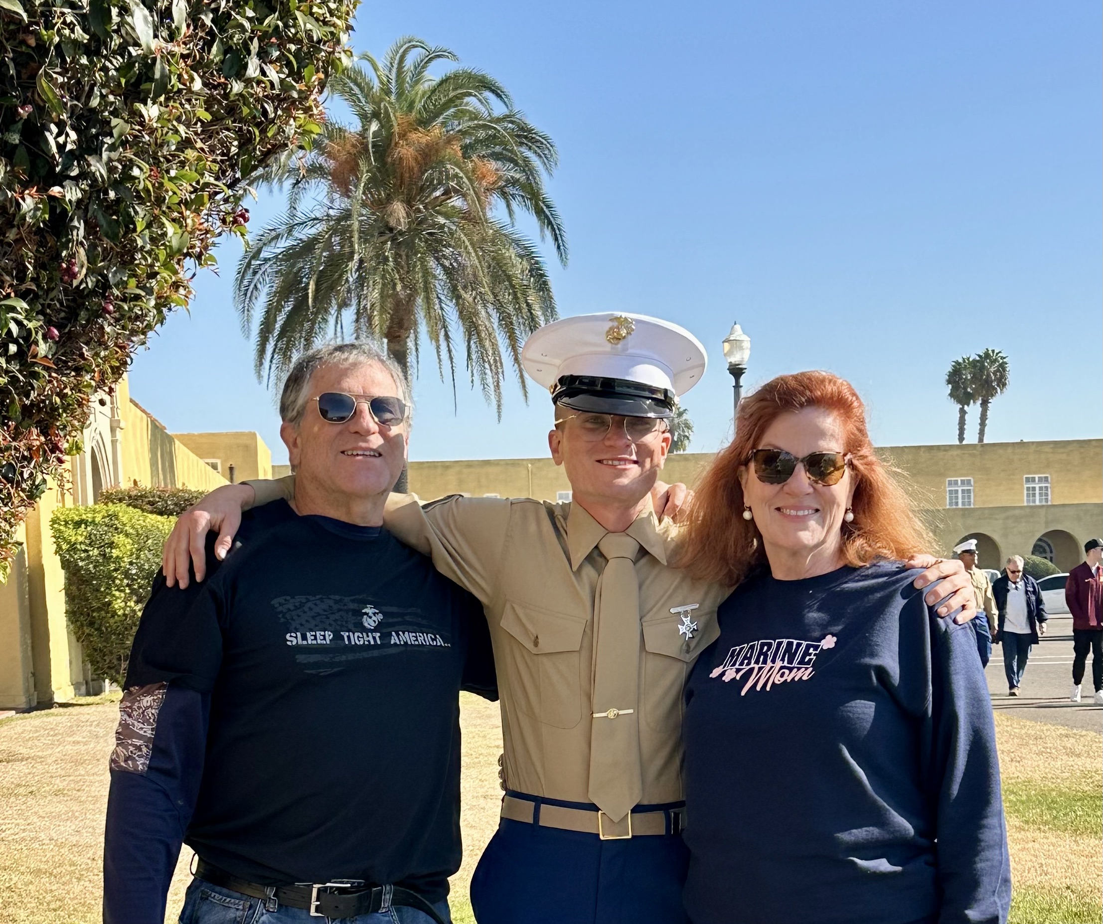 A group of people posing for a picture
Description automatically generated