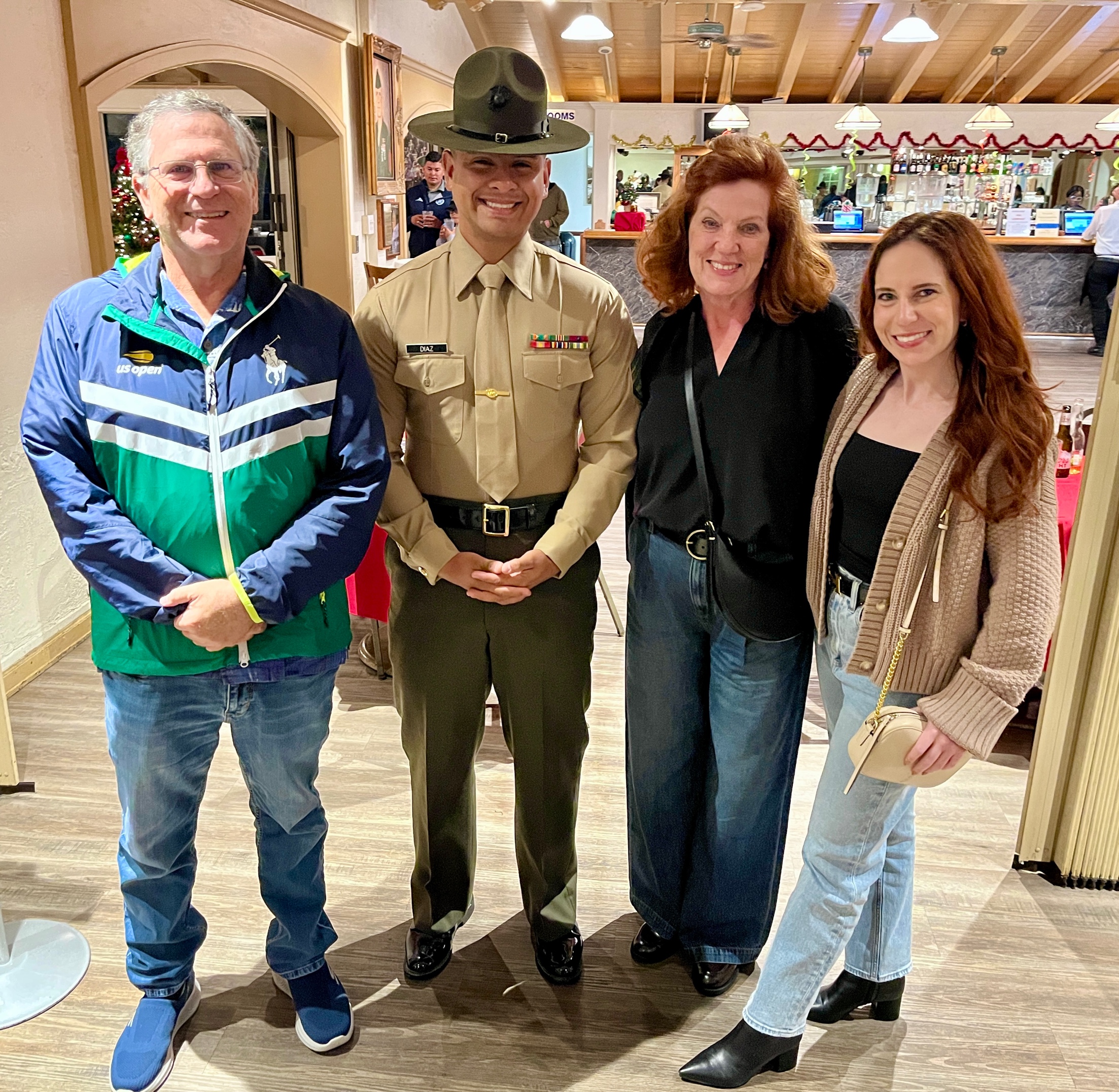 A group of people posing for a photo
Description automatically generated