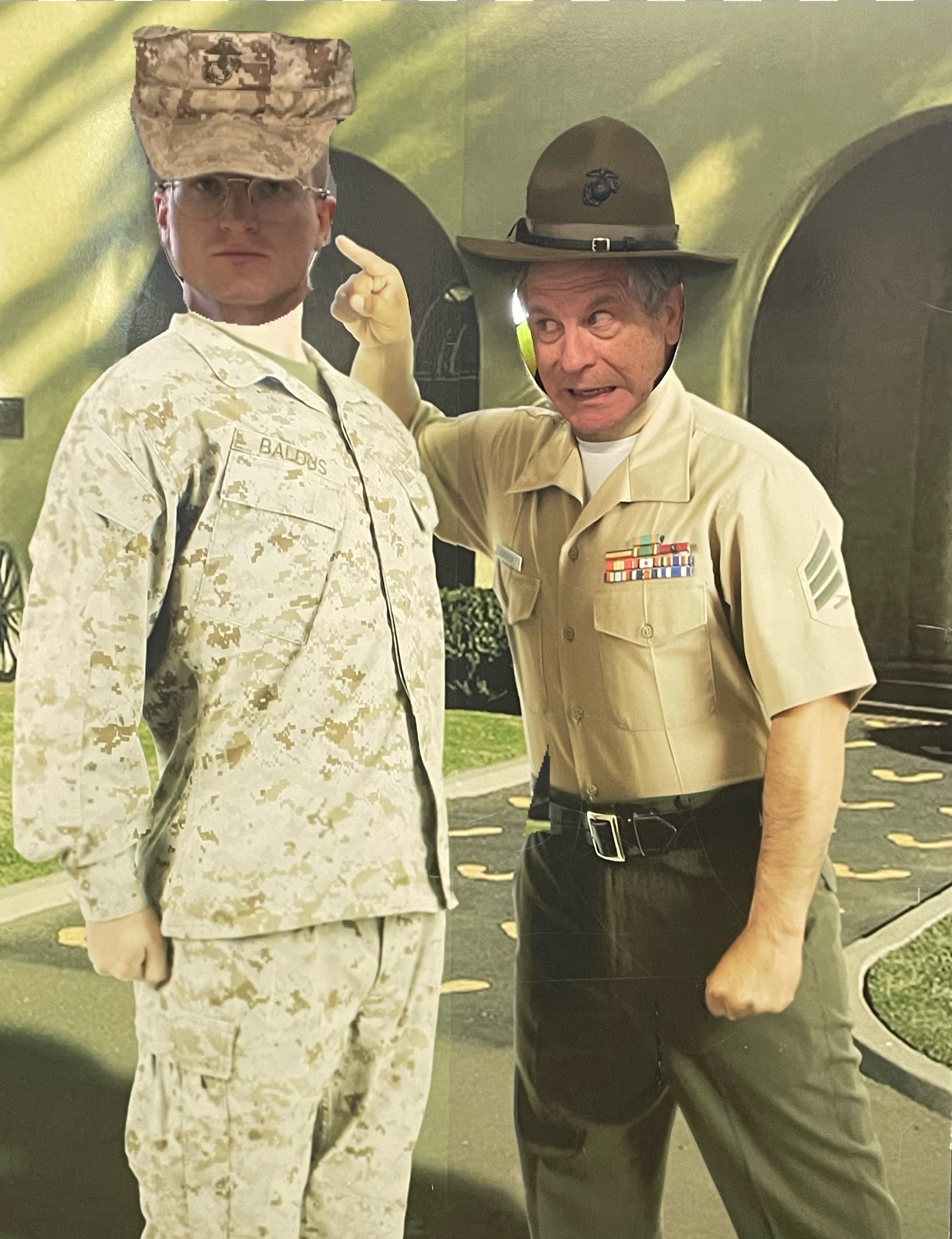 A person in military uniform pointing at a person's face
Description automatically generated