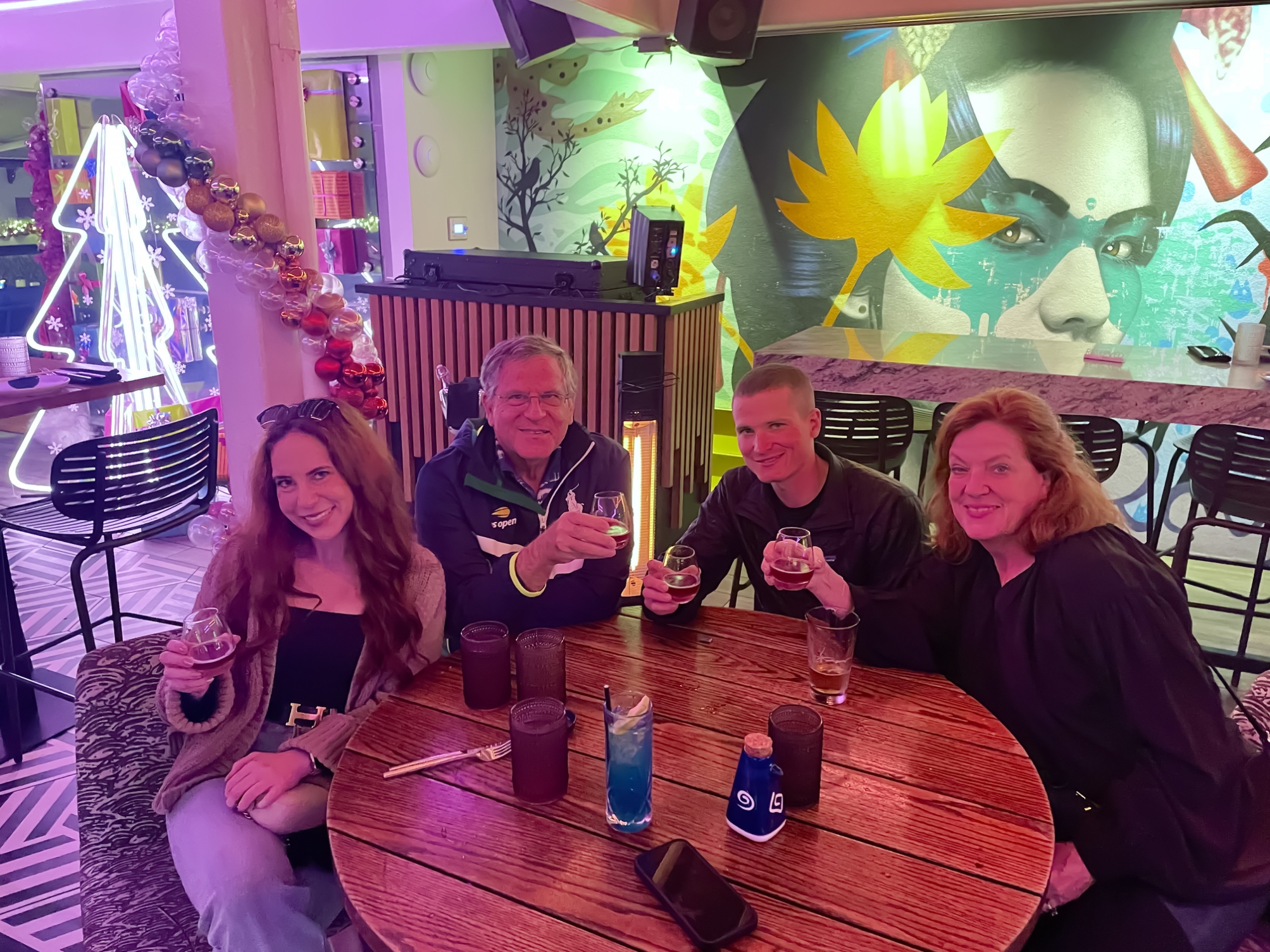 A group of people sitting at a table
Description automatically generated