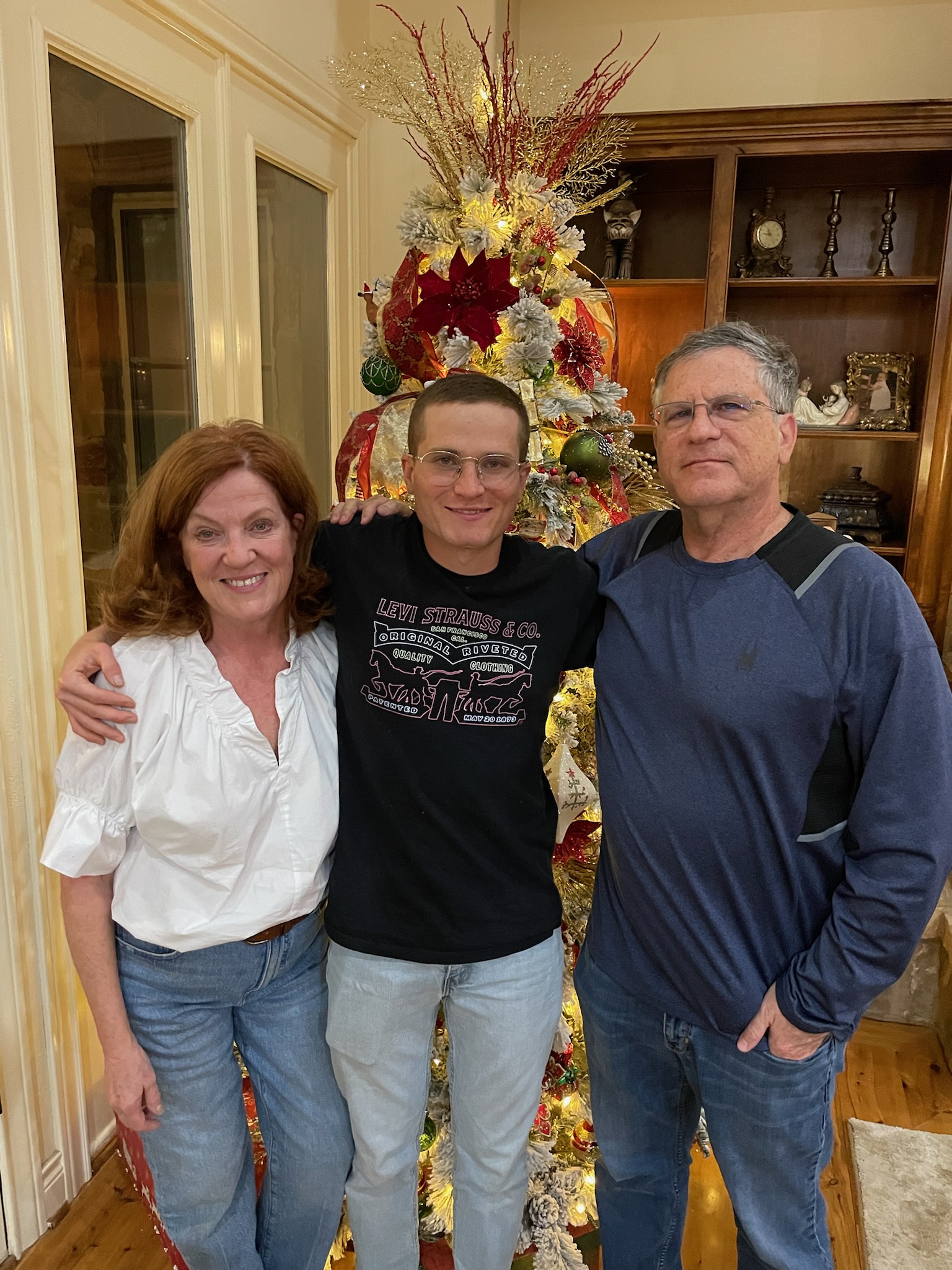 A group of people posing for a picture
Description automatically generated